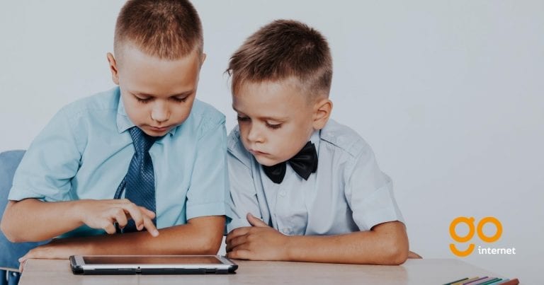 two school children browsing the internet